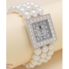Original y muy bonito reloj de cuarzo con perlas blancas.